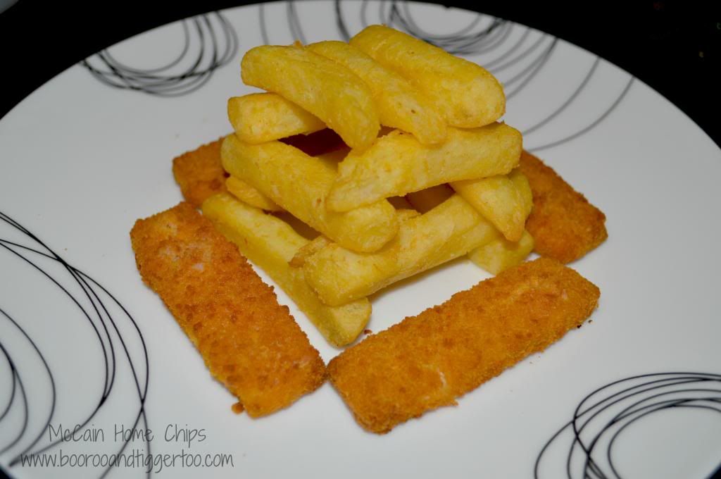 A plate of food with a slice cut out, with Fish finger and French fries