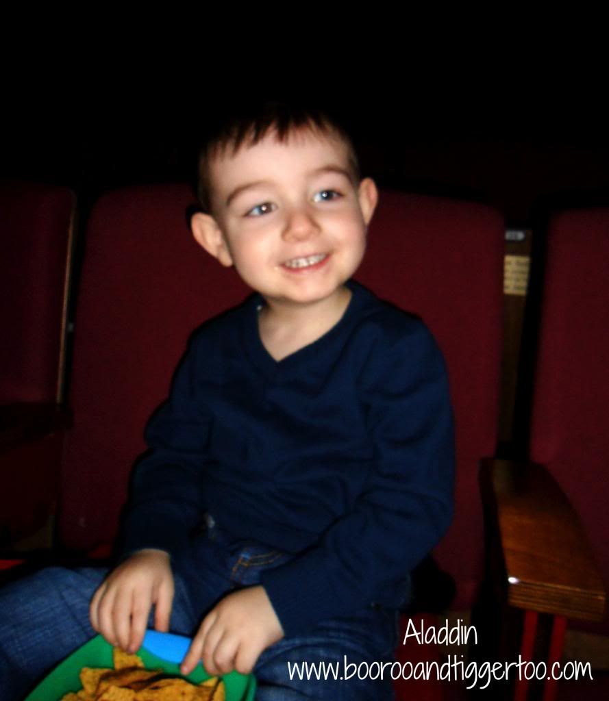 A young boy sitting on a table