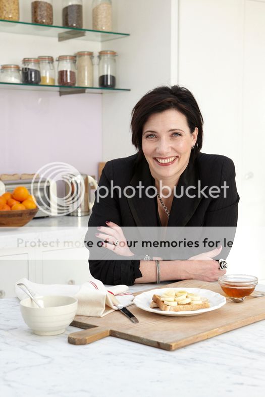 Tanya Byron sitting at a table with food