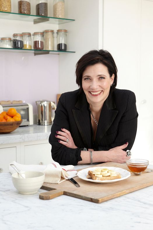 Tanya Byron sitting at a table with food