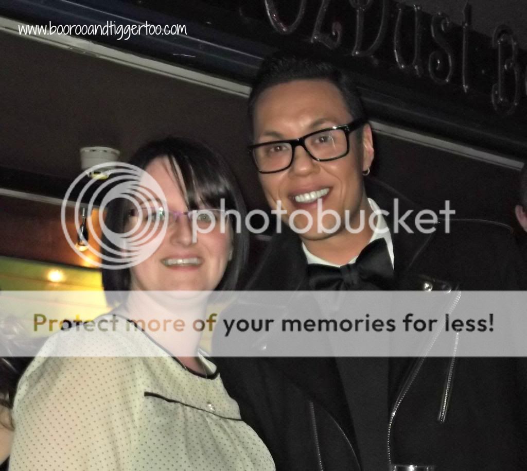 Gok Wan wearing glasses and smiling at the camera